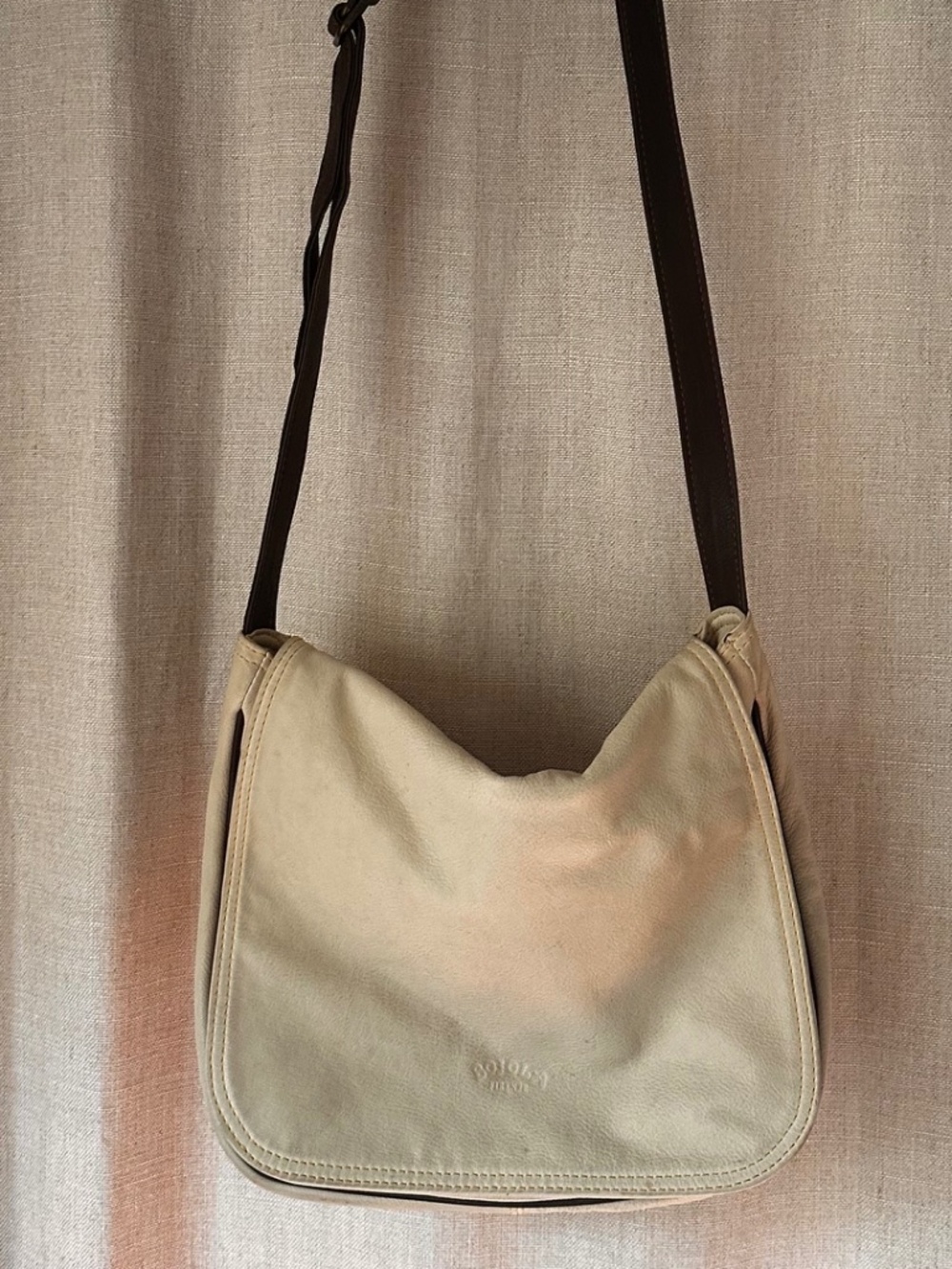 100% leather neutral Messenger Bag.
